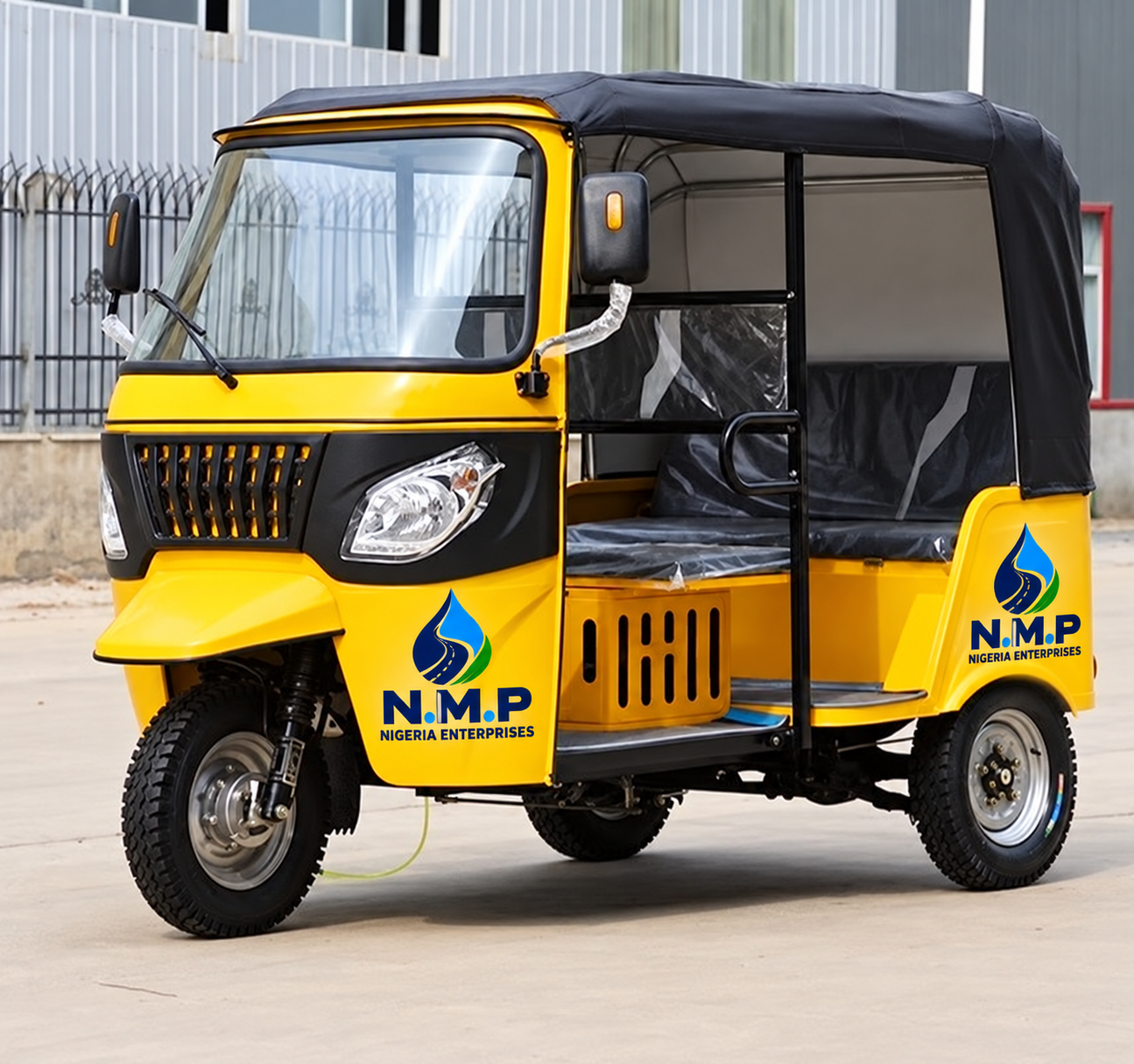 Yellow Keke Napep with N.M.P Nigeria Enterprises branding